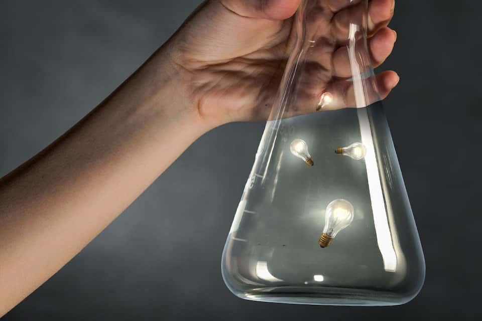 Article featured image showing lamps in a laboratory glass to represent a lab of ideas.